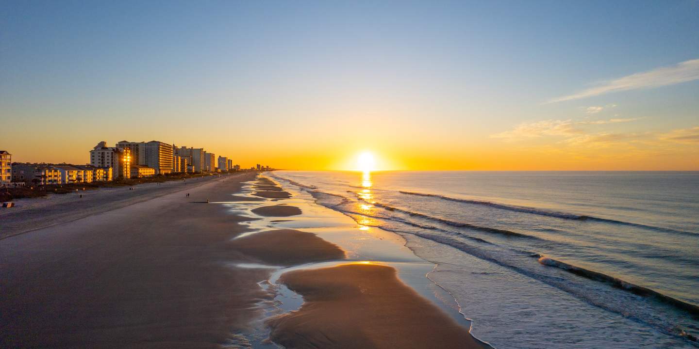 North Myrtle Beach shoreline glowing at sunrise