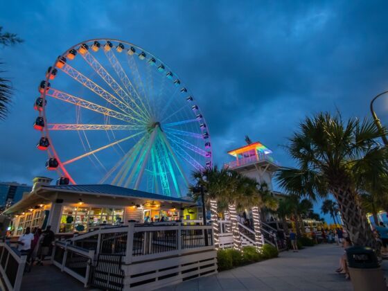 The illuminated SkyWheel on the Myrtle Beach Boardwalk at dusk